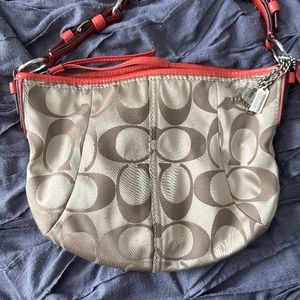 Coach purse with coral accents